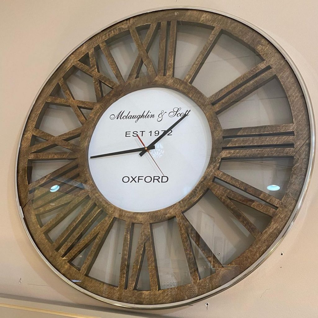 Our McLaughlin and Scott large wall clock, made of wood with aluminum